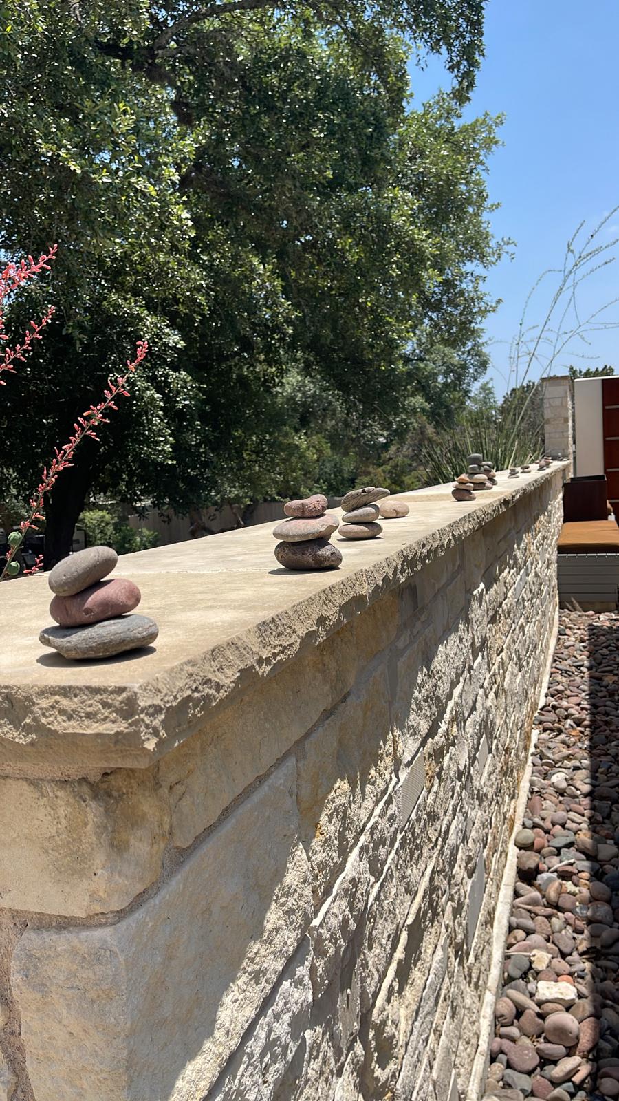 Photo of stacked rocks on a stone wall